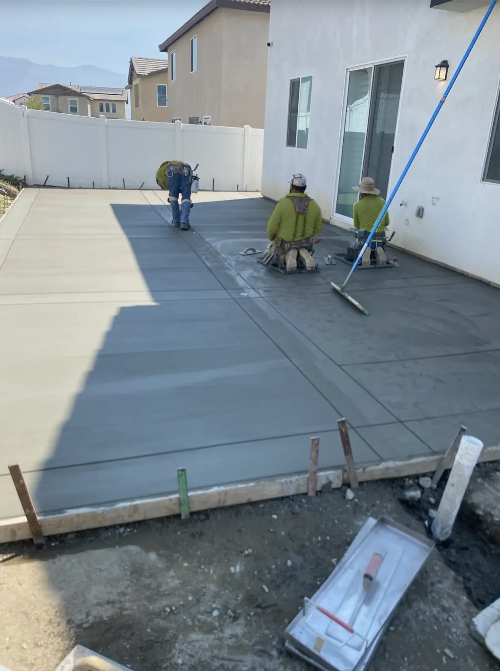 Our crew finishing a concrete patio slab in Perris, CA
