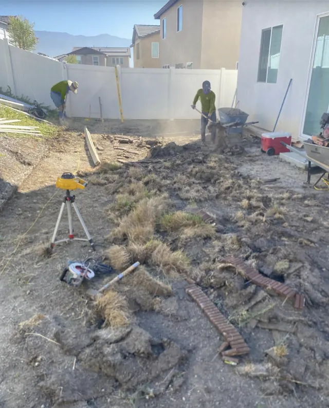Crew tearing out an old lawn