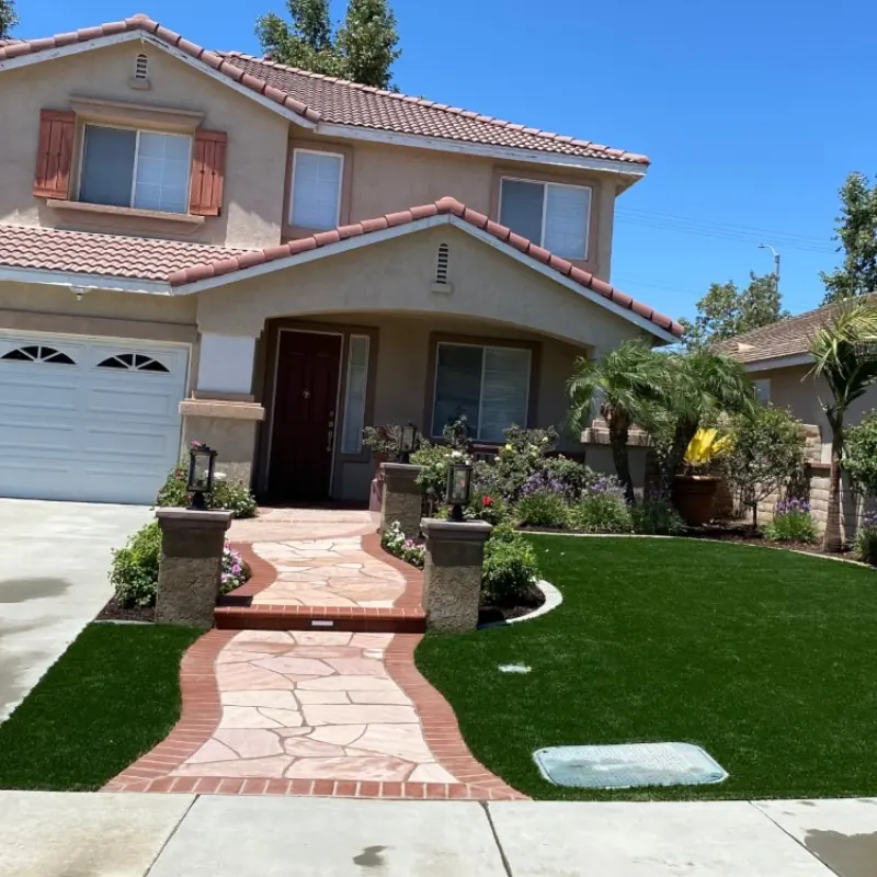 Designed front entry with pavers and artificial grass in Perris, CA