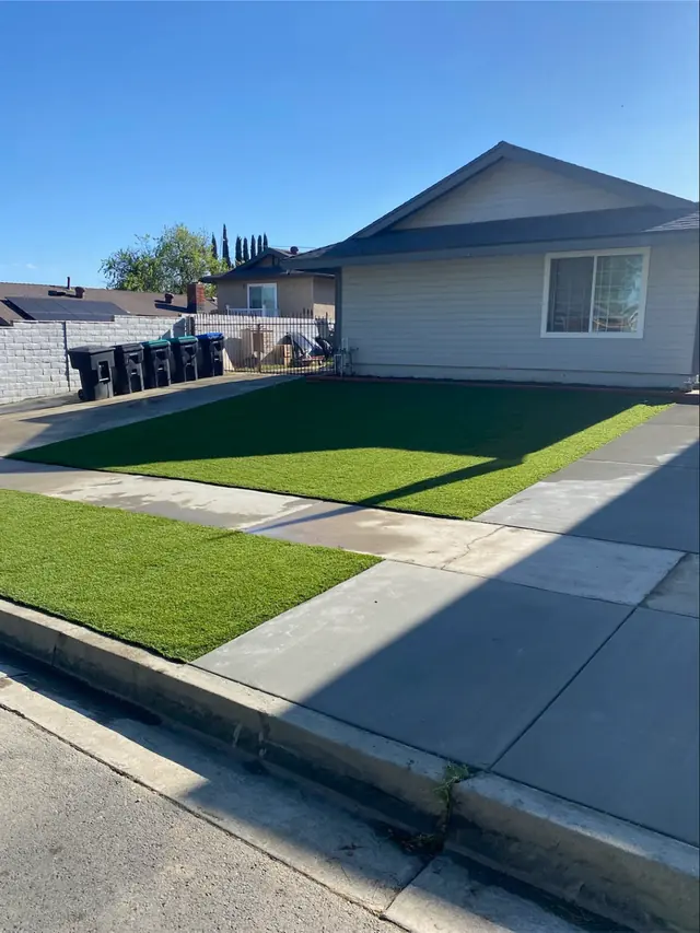 Artificial grass front lawn at a house in Perris, CA