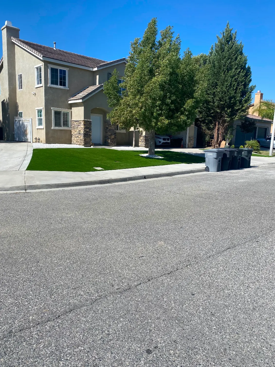 Artificial grass front yard seen from the street in Perris, CA