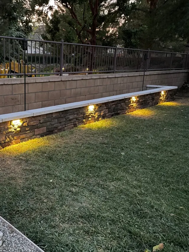 Lit retaining wall in a Perris, CA back yard