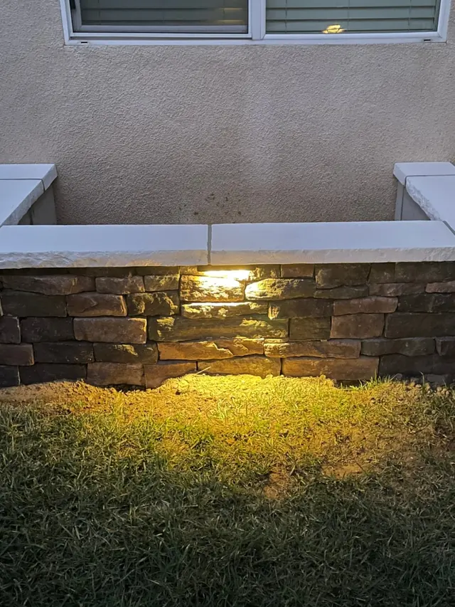 Landscape lighting on a wall in Perris, CA