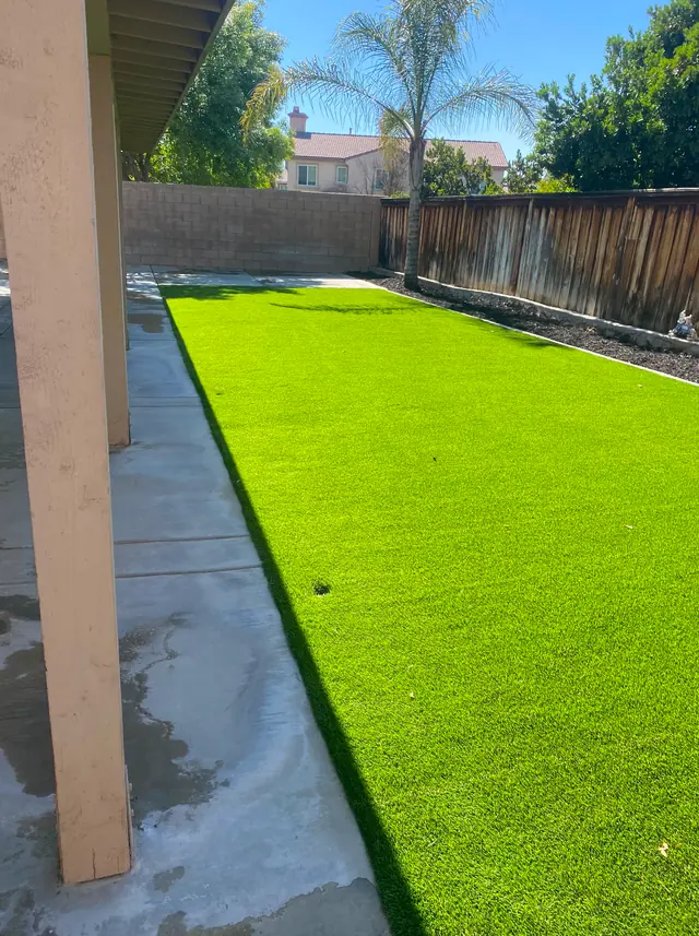 Strip of artificial turf along a patio in Perris, CA