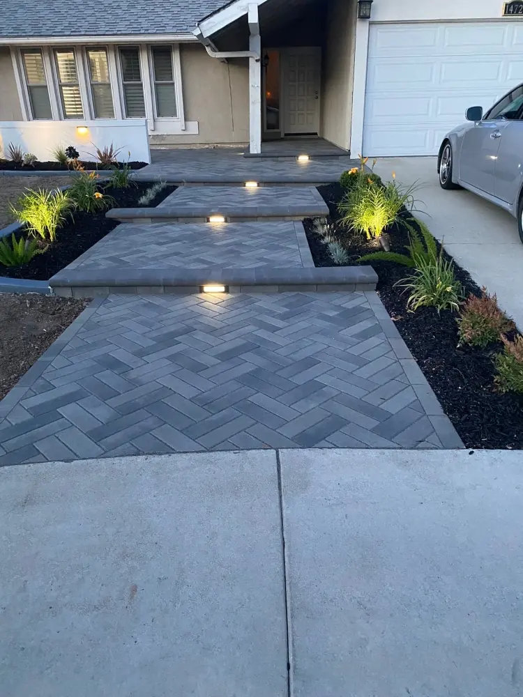 Paver walkway with landscape lighting installed in Perris, CA