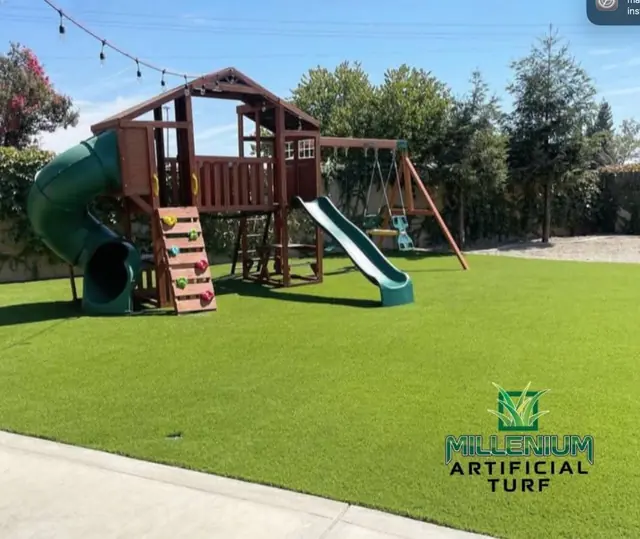Artificial grass under a backyard swing set