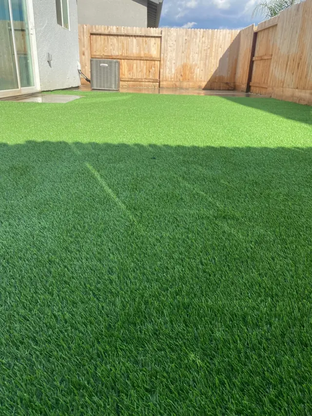 Close-up of the artificial grass blades we install in Perris, CA